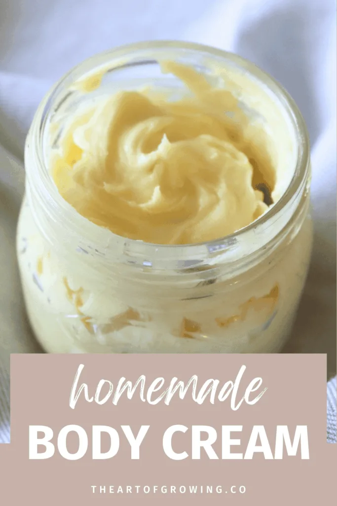 whipped body cream in jar on blue hand towel